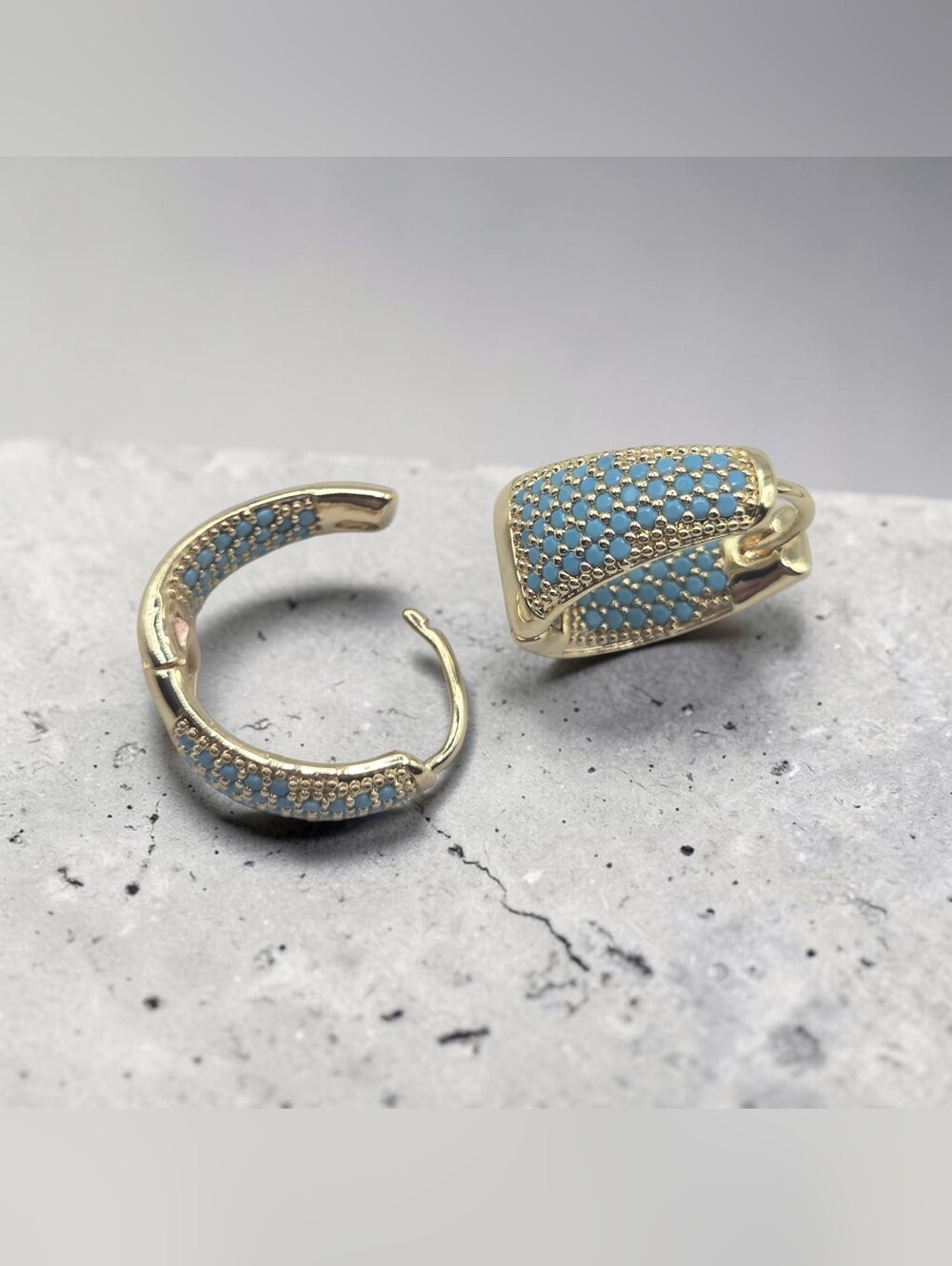 Goldtone Huggie Earrings with Blue Accents